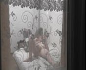 Peeping through windows. Voyeur. In evening, on street random passerby guy looking into bedroom window and filming on camera smartphone as sexy blonde MILF undresses, goes to bed, masturbates pussy, gets strong wet orgasm. Outdoors Outside from voyeur windows