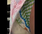 Girl messing diaper under dress from messing her diaper