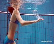 Cute teen Martina swimming naked in the pool from nadando piscina com hermana